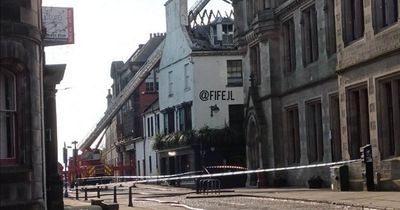 Firefighters battle blaze above Scots restaurant through night with crews still at scene