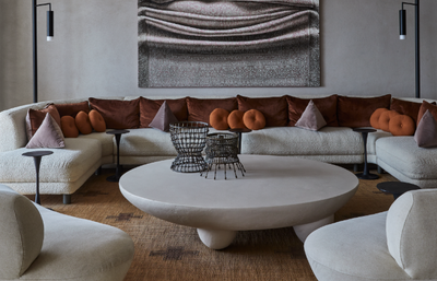 How do I make my grey couch look more cozy? Design experts on the 6 small tricks that make a big difference