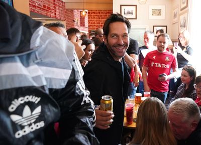 Paul Rudd drinks beer and sings chants with fans at Wrexham pub