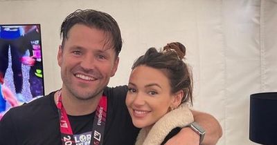 Proud Michelle Keegan beams as she supports husband Mark Wright at London Marathon