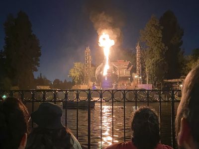 A fire-breathing dragon bursts into flames during a popular Disneyland show