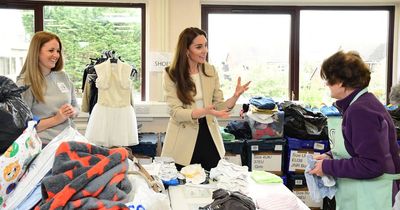 Cheery Kate Middleton reminisces as she folds clothes on surprise visit to baby bank