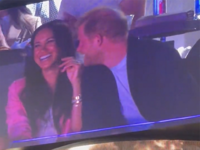 Meghan appears to dodge Harry’s advances as couple appear on Jumbotron at Lakers game
