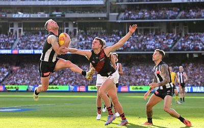 Collingwood runs down Essendon in Anzac Day classic at packed MCG