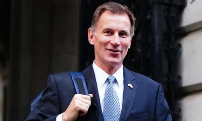 UK government borrowed £13bn less than expected last year