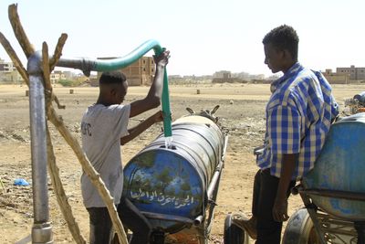 Sudan fighting forces aid groups to halt, spreading suffering