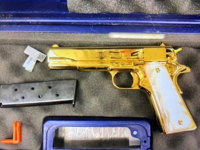 American woman with gold-plated gun in case arrested in Australia