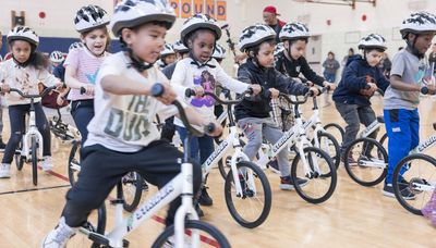 Off to the races: NASCAR partnership donates bikes to Chicago kindergartners