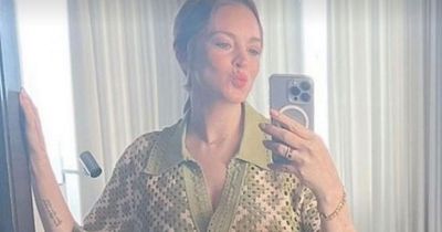 Pregnant Lindsay Lohan glows in first selfie showing blossoming baby bump
