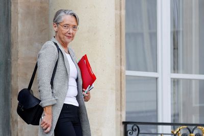 French PM delays immigration bill over lack of majority