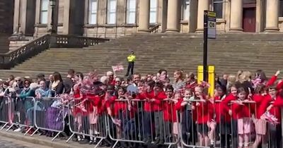 Schoolkids chanting 'He's OUR King' drown out protesters as Charles visits Liverpool