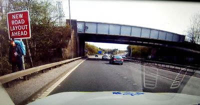 Edinburgh police catch hitch-hiker walking along busy M8 motorway during the day