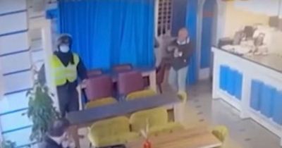 Moment man gunned down in cafe with police hunting Brits over public execution