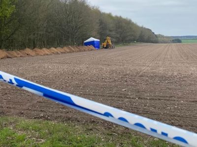 Police investigation after human remains found in field