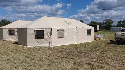 Tent camp under construction for remote Northern Territory flood evacuees in Yarralin