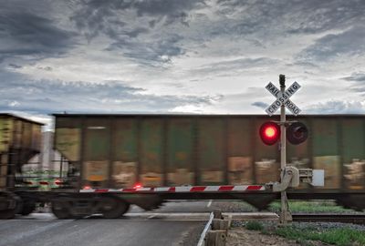 School kids forced to crawl under trains