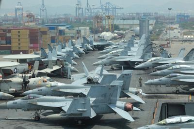 Ties hailed as US strike group docks