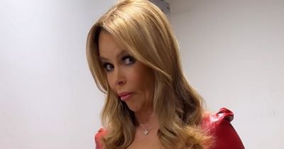 Amanda Holden stuns in red latex dress as fans ask 'how do I apply' as they spot unusual job