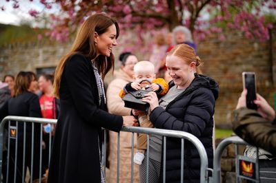 Cheeky baby snatches handbag from British royal Kate