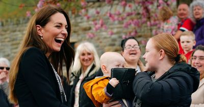 'Priceless' moment baby grabs Kate's handbag during royal Aberfan visit