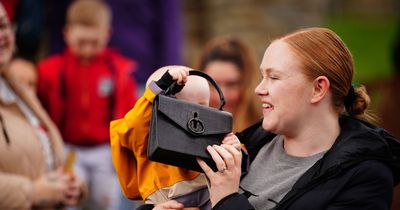 Kate Middleton's expensive designer handbag snatched by baby as mortified mum looks on