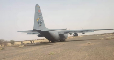 Sudan evacuation plane rescuing Brits pictured leaking fuel and covered with bullets
