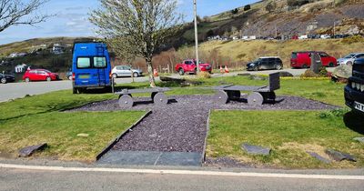 Camper vans are parking on a memorial to dead slate miners