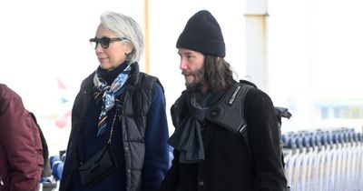 Smitten Keanu Reeves holds girlfriend Alexandra Grant's hand as they arrive in New York