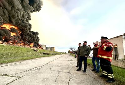 Crimea fuel depot on fire, Russian-held towns shelled in Ukraine