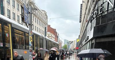 "WTF man": Moment sudden downpour floods Market Street as shoppers dodge