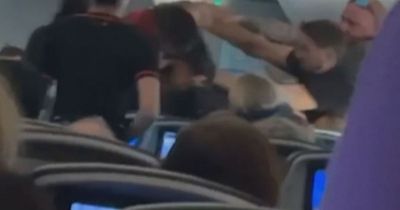 Half-naked passenger among three people dragged off Jetstar flight for causing chaos