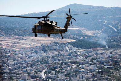 Israeli major disciplined for wearing uniform to political protest