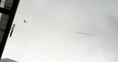 Plane flies over Anfield showing FSG banner during Liverpool vs Tottenham