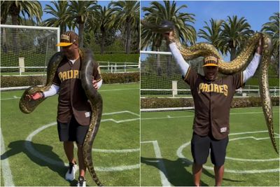 Check out Russell Wilson holding a massive 125-pound anaconda