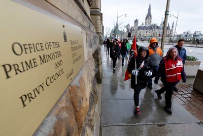 Some Canadian workers in wage pact with govt to end strike from Monday