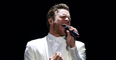 Olly Murs breaks down in tears over Caroline Flack live on stage as he admits 'regrets'