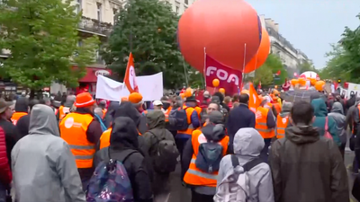 Watch live: Thousands gather on streets of Paris for May Day pension protests