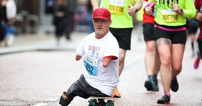 Belfast City Marathon: Man born without limbs finishes race on a skateboard