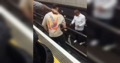 Terrifying moment three men jump onto Tube track to save mum on mobility scooter