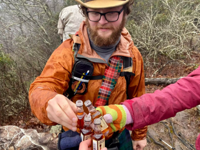 Can you tell who's holding the 4th bottle in this real-life optical illusion?
