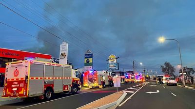 Police declare crime scene at factory fire south of Brisbane after three firefighters taken to hospital