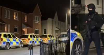 Armed police swoop on Kilmarnock estate as dozens of officers scour streets