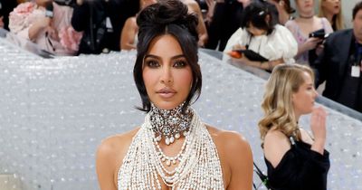 Kim Kardashian stuns on Met Gala red carpet in dramatic pearl outfit