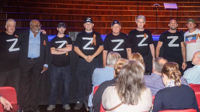 Russian Orthodox choir denounces group of men wearing pro-war Z symbol shirts at Sydney Town Hall event