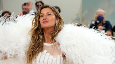 Gisele Bündchen steps out on Met Gala 2023 red carpet in vintage, angelic cape for first red carpet appearance since divorce