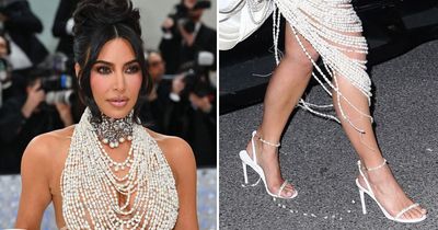 Kim Kardashian's Met Gala outfit FALLS APART at after party as she leaves trail of pearls