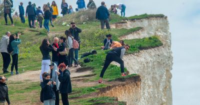 Tourists spotted teetering on UK cliff edge despite warnings of recent collapses