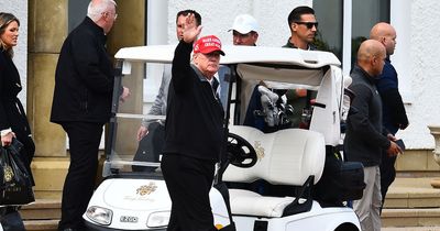 Donald Trump arrives at Turnberry in trademark Make America Great Again cap