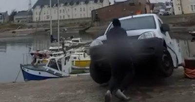 Moment yob films himself pushing white van into Scots harbour
