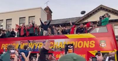 The moment Ryan Reynolds and Rob McElhenney belt out the Welsh national anthem on Wrexham victory parade